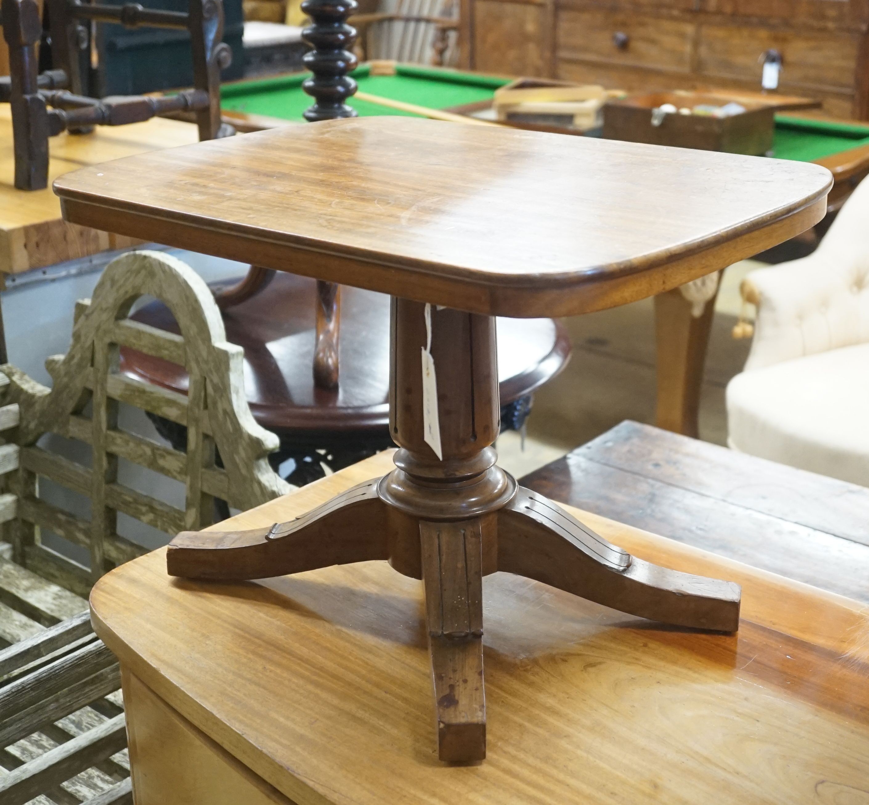 A miniature mahogany tablet-topped table, width 56cm depth 40cm height 38cm